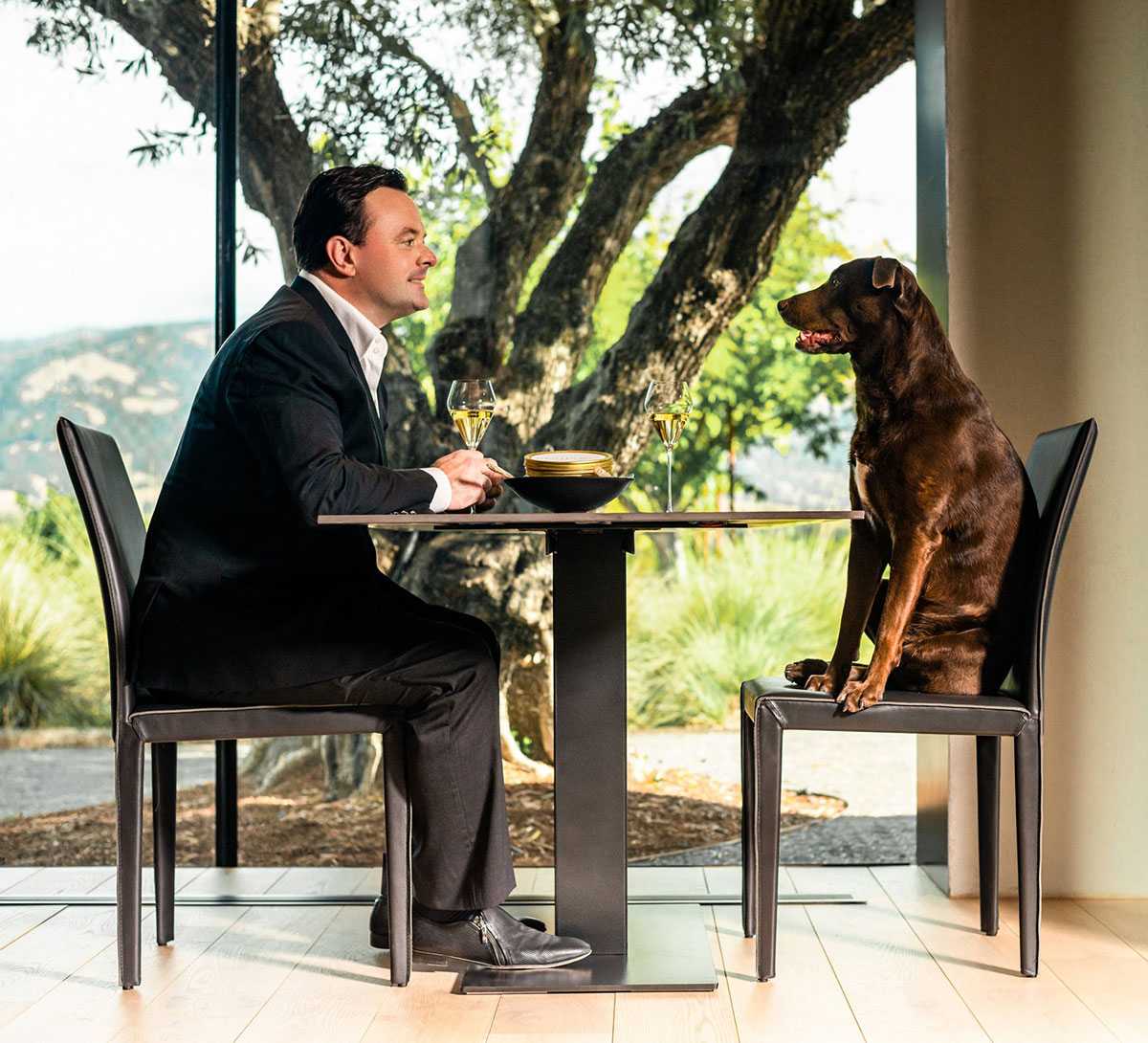 Douglas Keane dining with his dog