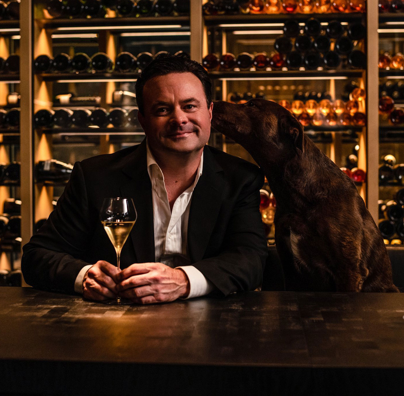 Chef Douglas Keane having a drink with his dog